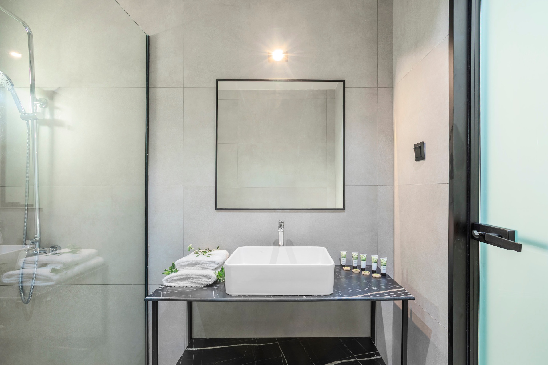 Apartment bathroom vanity with walk-in shower