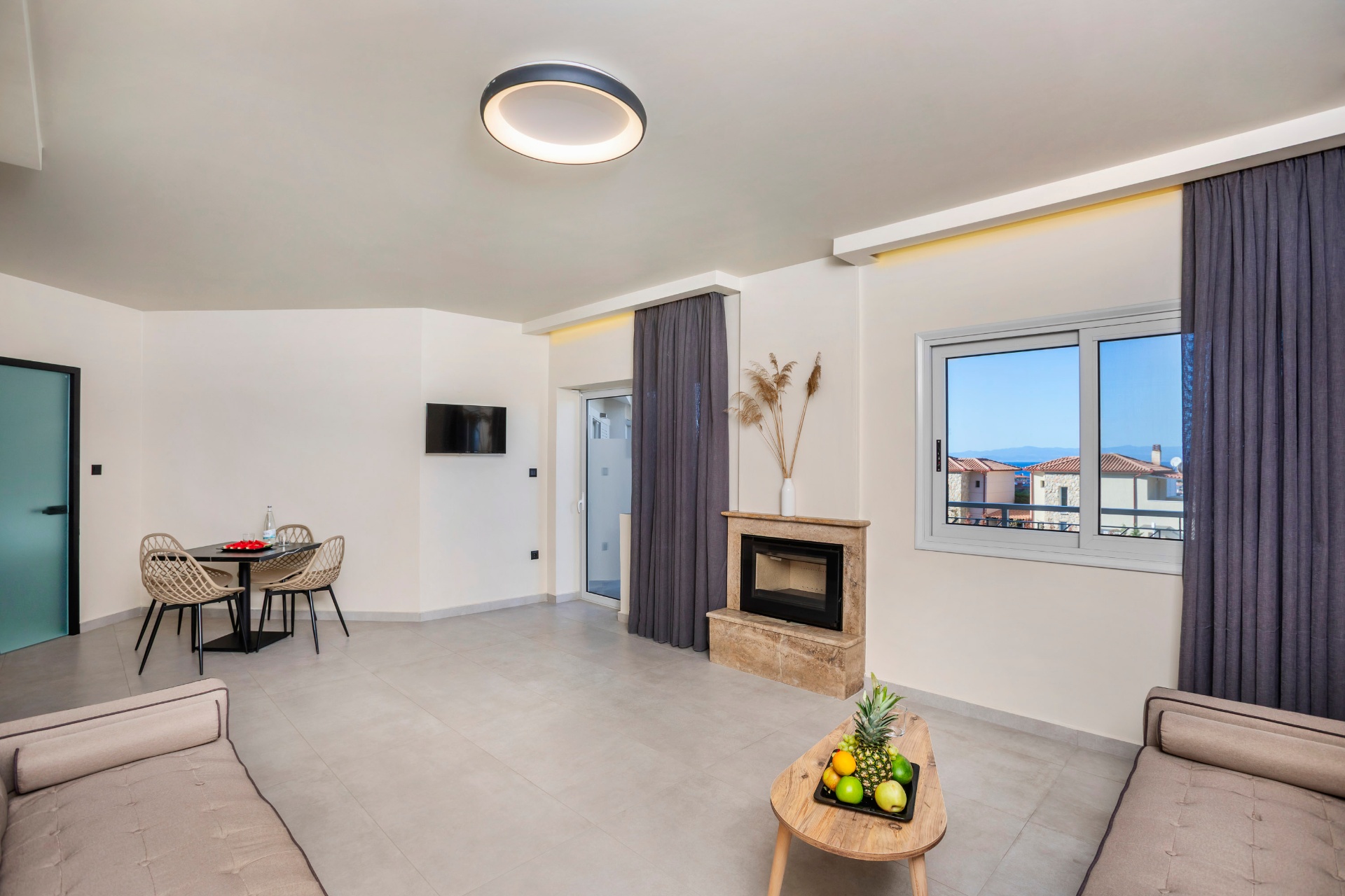 Apartment lounge with dining area and sea view