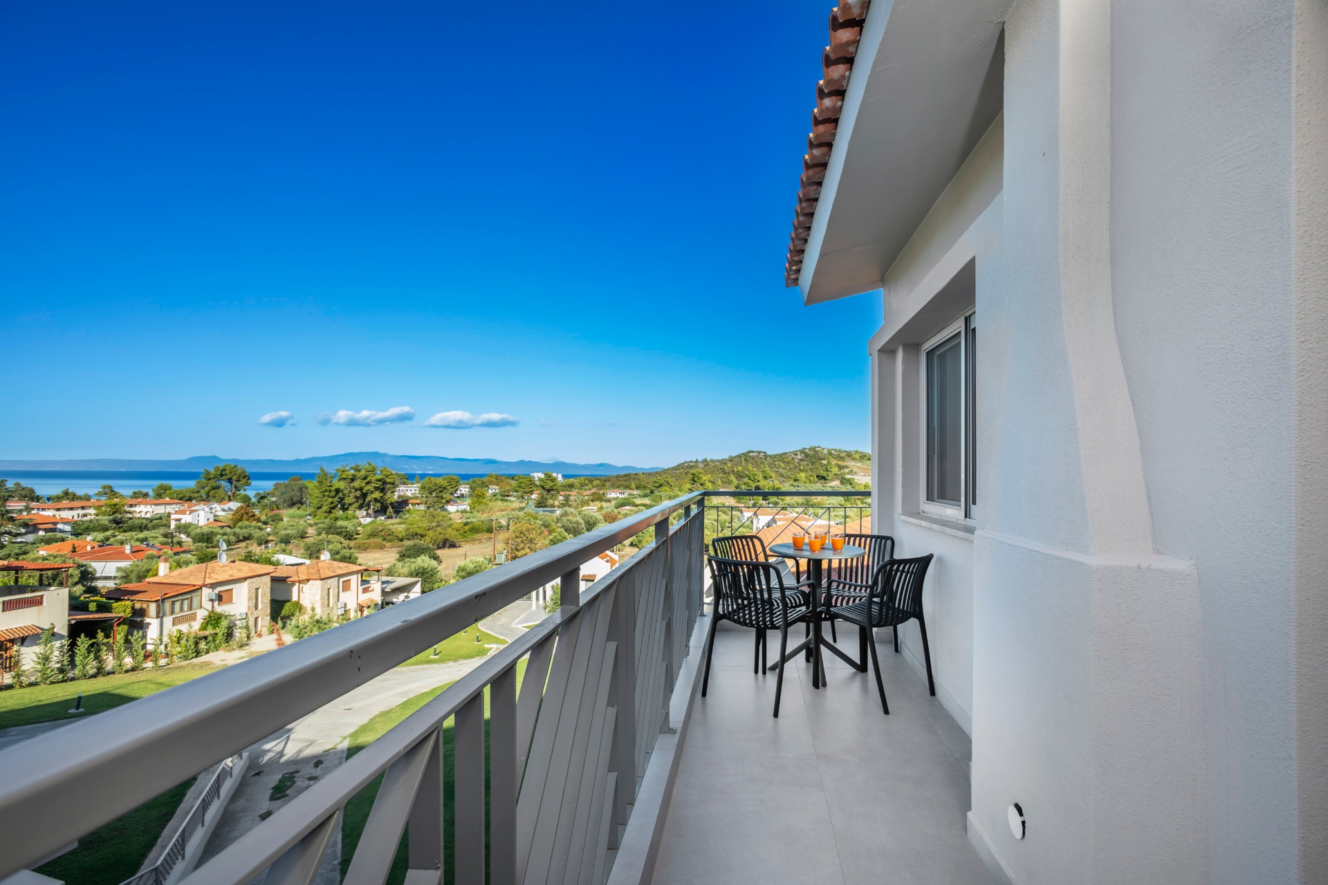 Private balcony with sea view and seating area