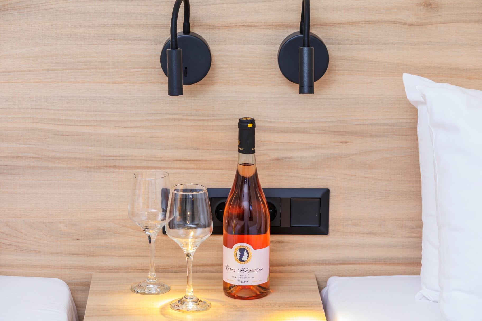 Bedside detail with welcome wine